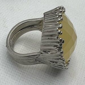 Elegant Silver and Yellow Gemstone Ring